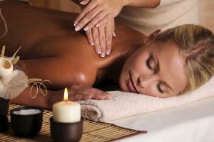 professional masseur doing massaging female neck in the beauty salon